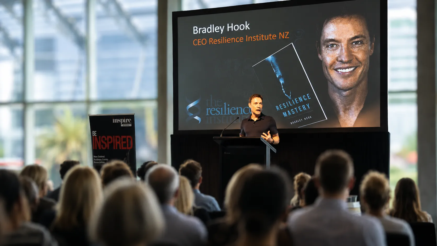 Bradley Hook presenting to a full room at a corporate event