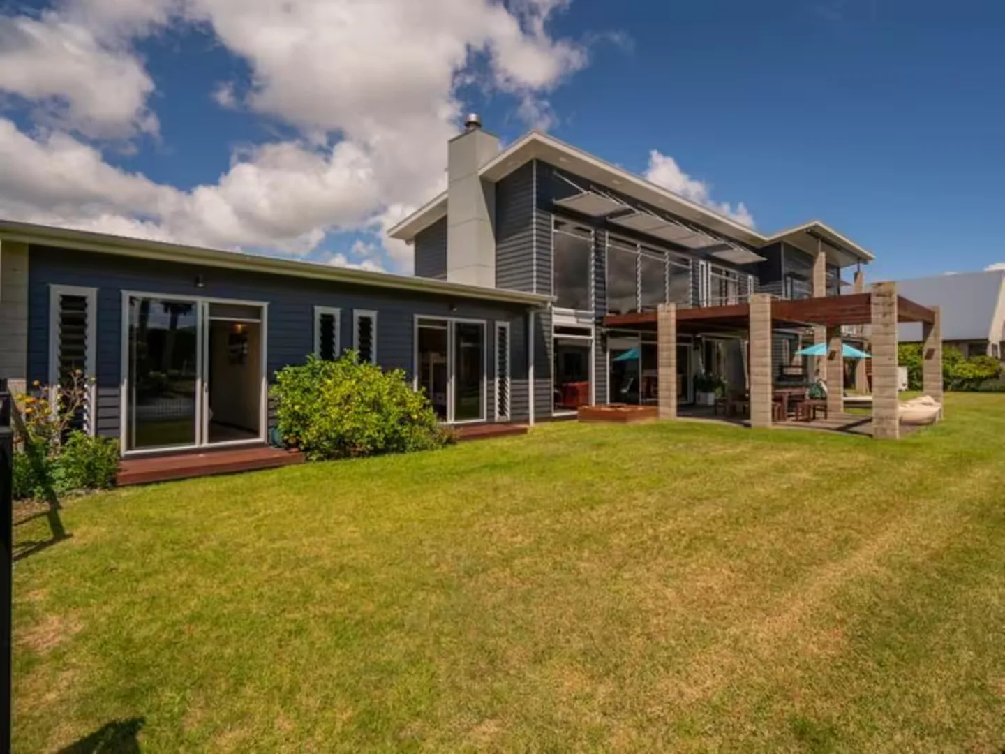 The retreat house exterior, deck and lawn